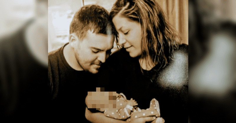 Six-month-old baby found alive in Michigan motel room where her parents lay dead for three days