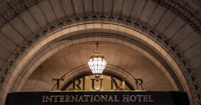 Messages like 'Rapist in the White House' were projected onto Trump Hotel for sexual awareness month