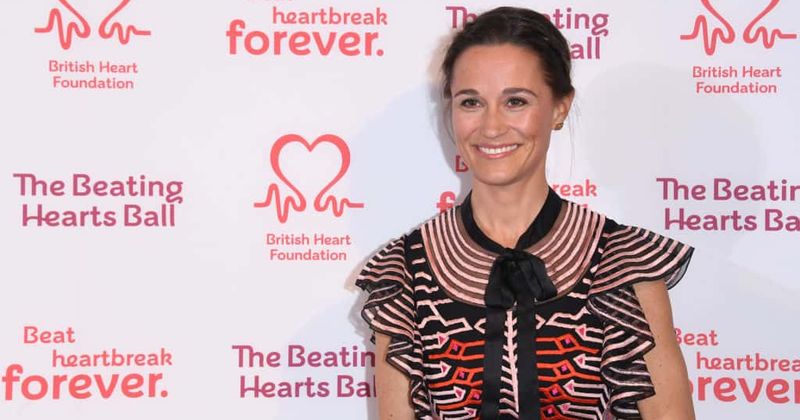 Pregnant Pippa Middleton shows off a tiny hint of a baby bump in new pink dress