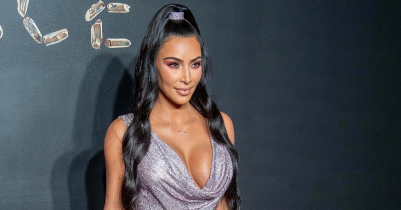 Kim Kardashian flaunts her toned legs as she channels vintage Versace in sparkly miniskirt