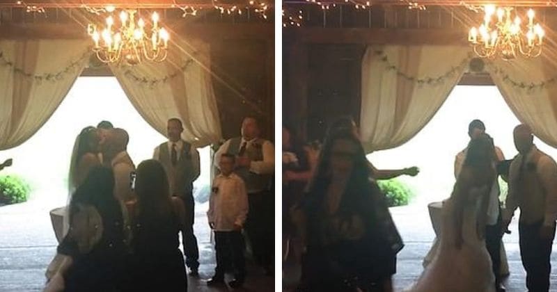 Savage wedding photographer shoves bride's step-mum out of the way to capture couple's first kiss