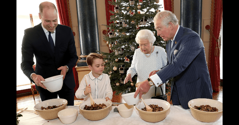 Prince George steals the show as he mixes Christmas pudding with the Queen, Prince Charles and Prince William in rare photos