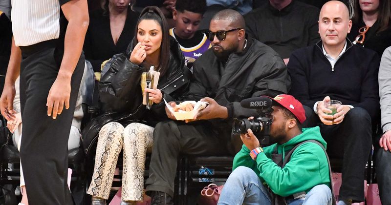 Kim Kardashian wolfs down french fries at Lakers game, despite being on a strict diet of 'real foods'