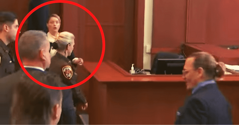 Amber Heard appears startled as Johnny Depp approaches her in very AWKWARD moment in court