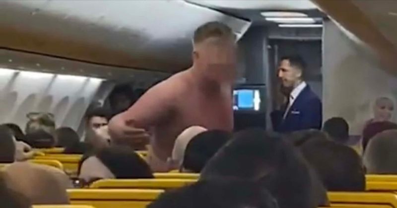 Video of bare-chested man on plane screaming at crew and fellow passengers goes viral