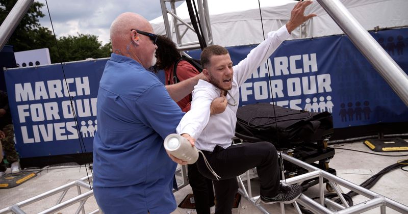 STAMPEDE at March For Our Lives protest after man storms stage screaming 'I am the gun'