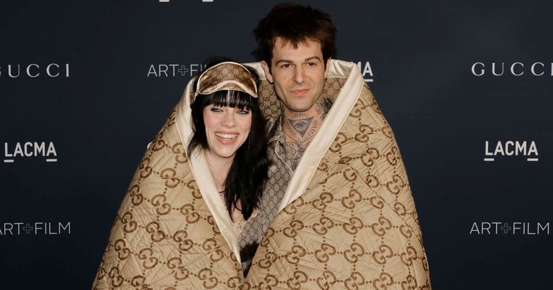 Billie Eilish and boyfriend Jesse Rutherford make red carpet debut as couple wrapped in a Gucci blanket