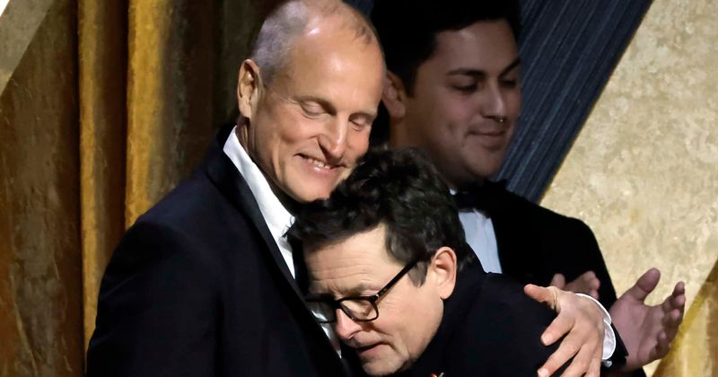Woody Harrelson hugs Michael J Fox while giving him honorary Oscar at 2022 Governors Awards