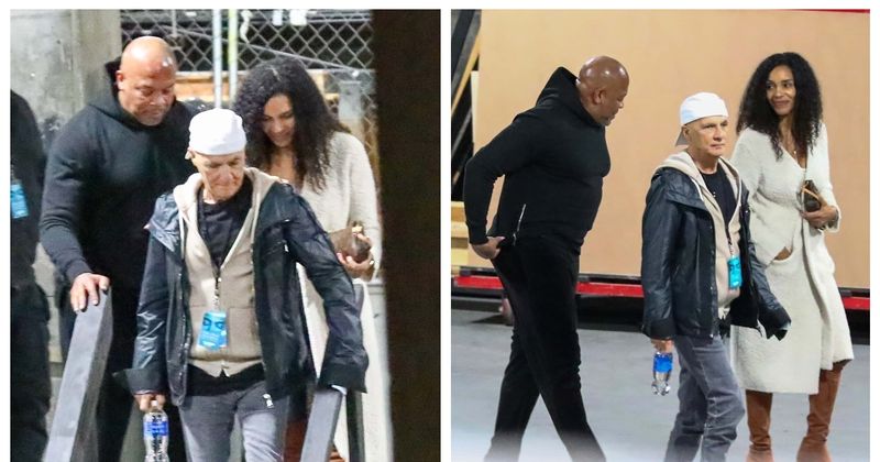 Dr Dre smiles alongside a 'mystery woman' while attending Chris Rock's stand up show in Hollywood