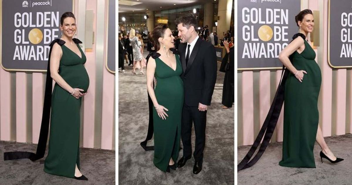 Hilary Swank flaunts baby bump in green Prada gown as she kisses husband Philip Schneider at Golden Globes