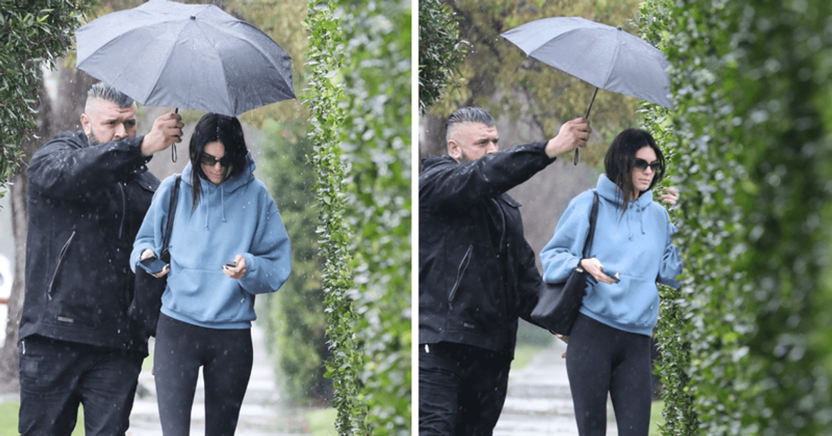 'You have two hands': Kendall Jenner dragged for not holding her own umbrella during rainstorm