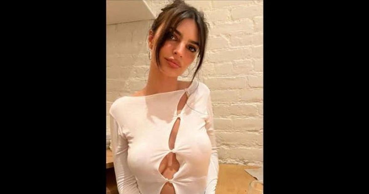 Emily Ratajkowski gives fans a peek at her ample cleavage and toned midriff during a sushi date