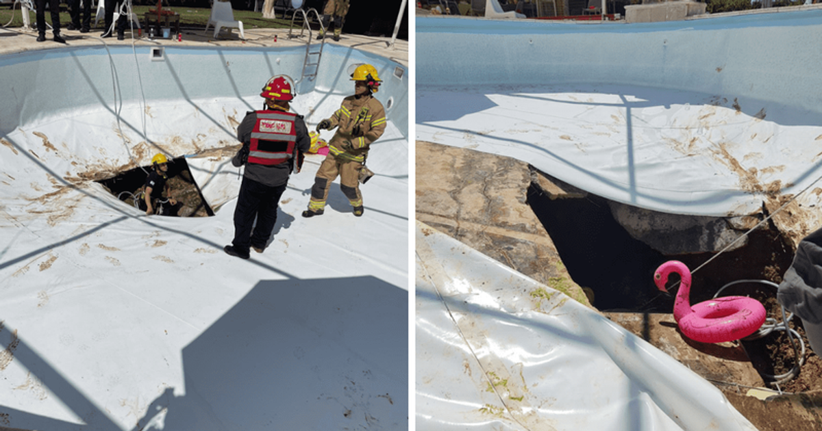 Video shows moment huge sinkhole opens up under swimming pool during(02)