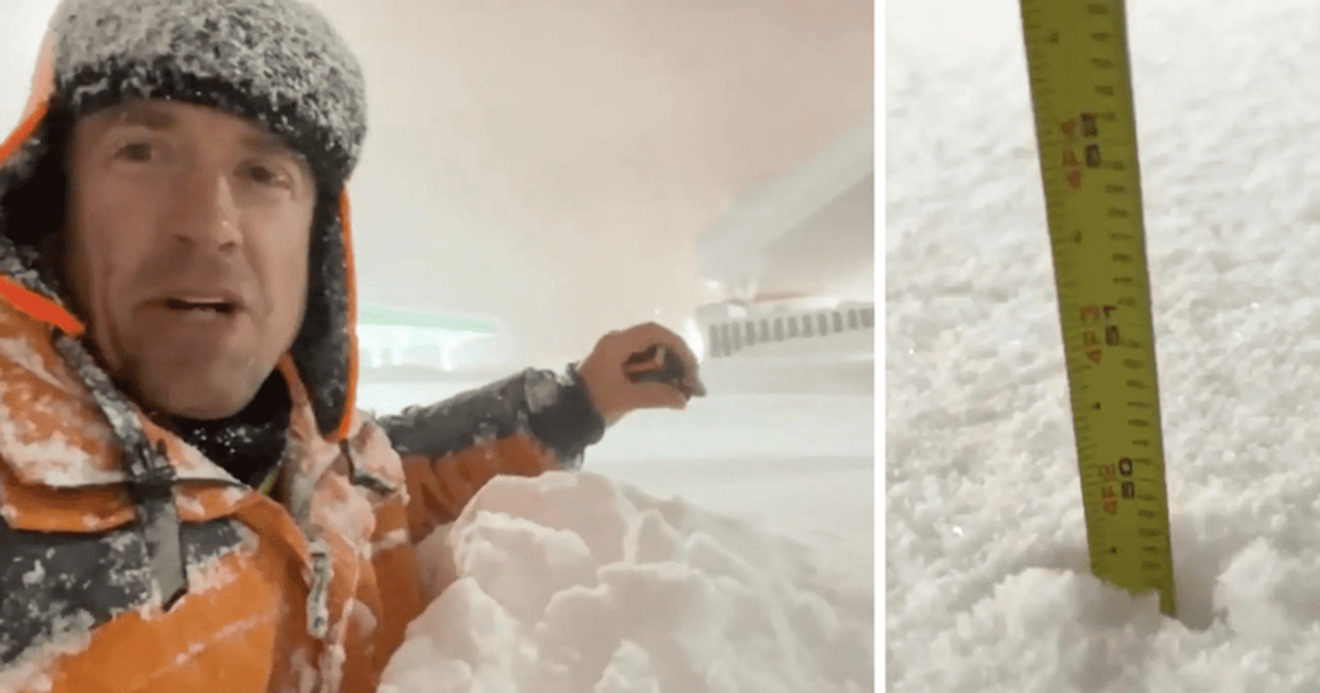 Meteorologist Reed Timmer measures chesthigh snow while reporting